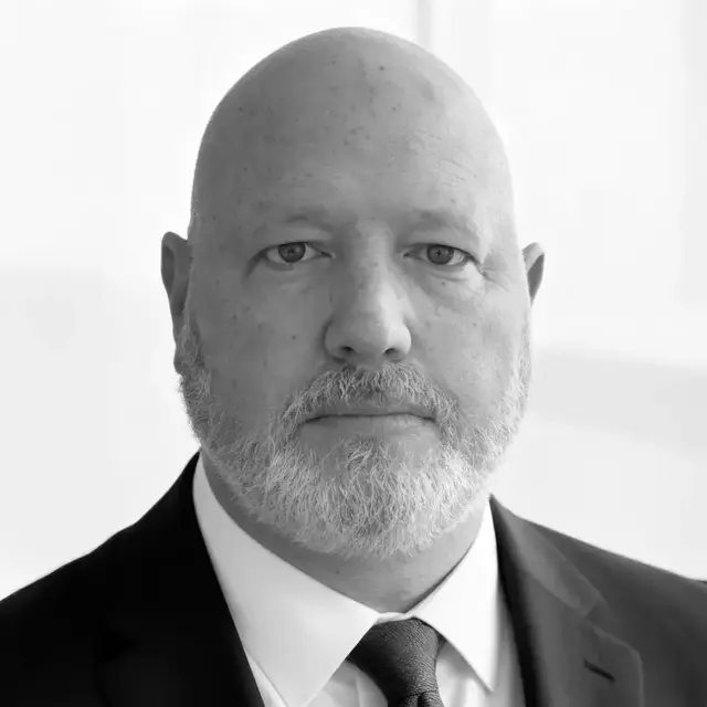 A headshot photo of Ryan Bell, Intellinetics CTO