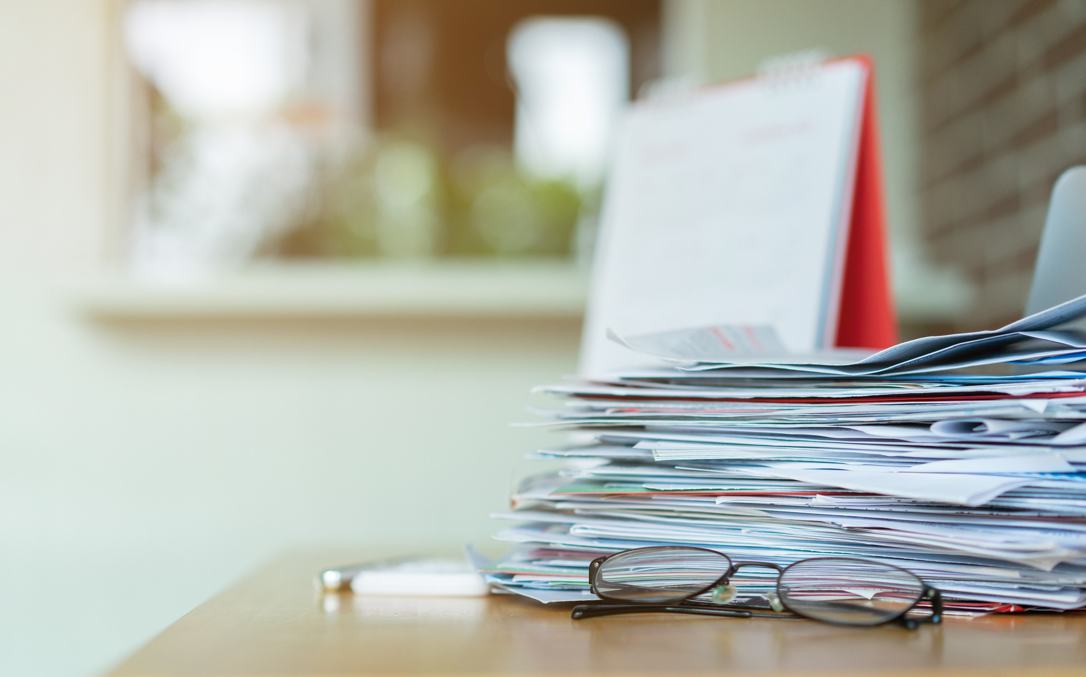 stack of papers on a desk