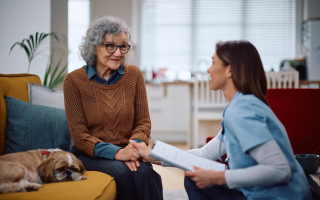 home care  aid consulting with a client