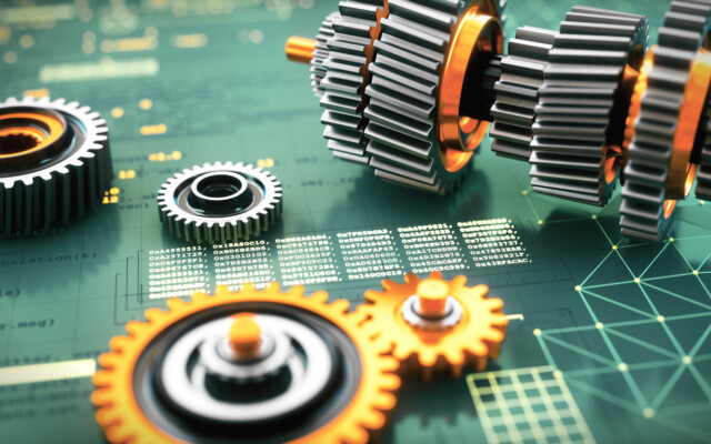 Engineering 3D computer aided design concept, with metallic gears on a virtual reality blueprint surface with programming code. Camera zooming in, defocused, low angle composition.