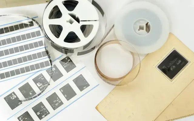 Microfilm reels, microfiche, aperture cards, and other micrographic media representing archival records and document preservation.