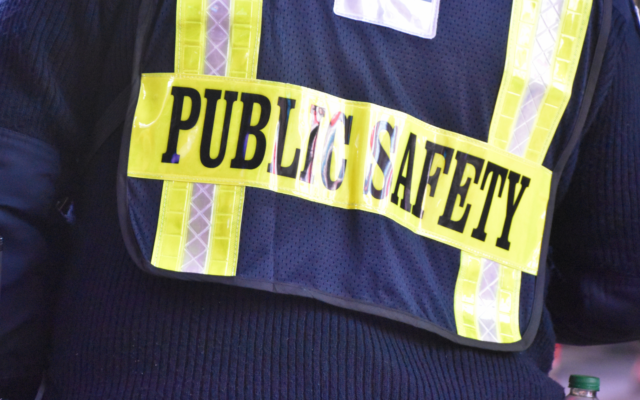 close up image of a person wearing a public safety vest