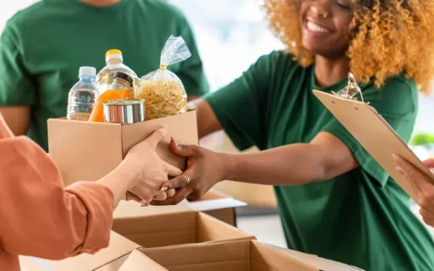 a volunteer at a non-profit organization distributing food