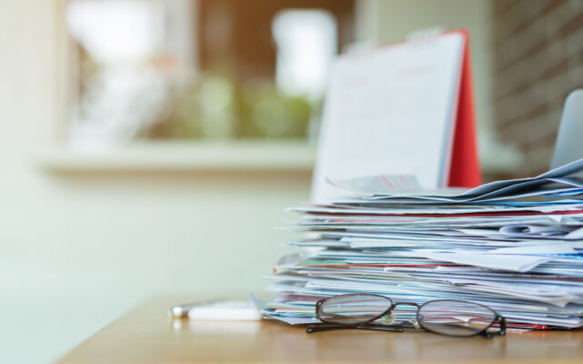 stack of papers on a desk