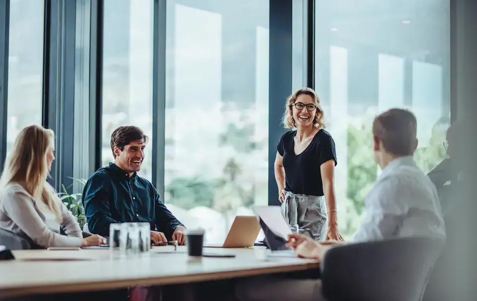 Business professionals collaborating during a consultation meeting in a modern conference room.
