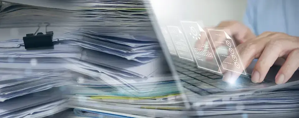 Stacks of paper documents transitioning to a laptop with digital document graphics, representing document scanning and digitization.