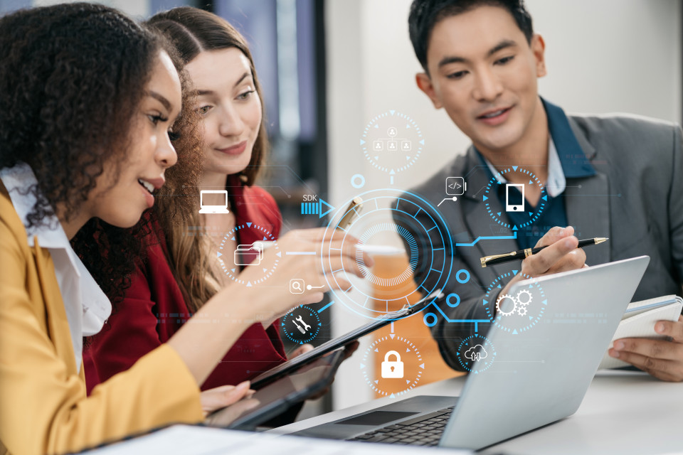 three employees at computer