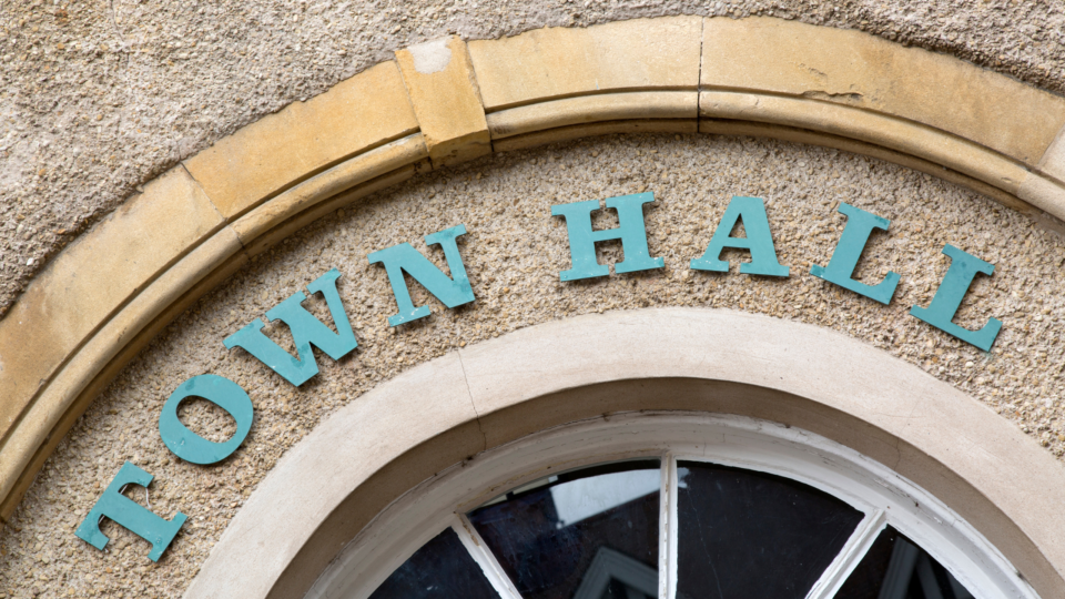 Close-up of the words town hall on the front of a municipal building
