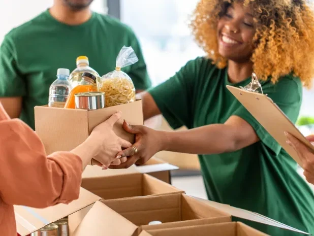 a volunteer at a non-profit organization distributing food